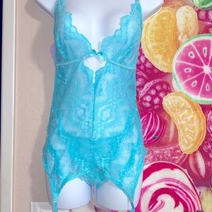 Lacy garter slip with matching thong panties.